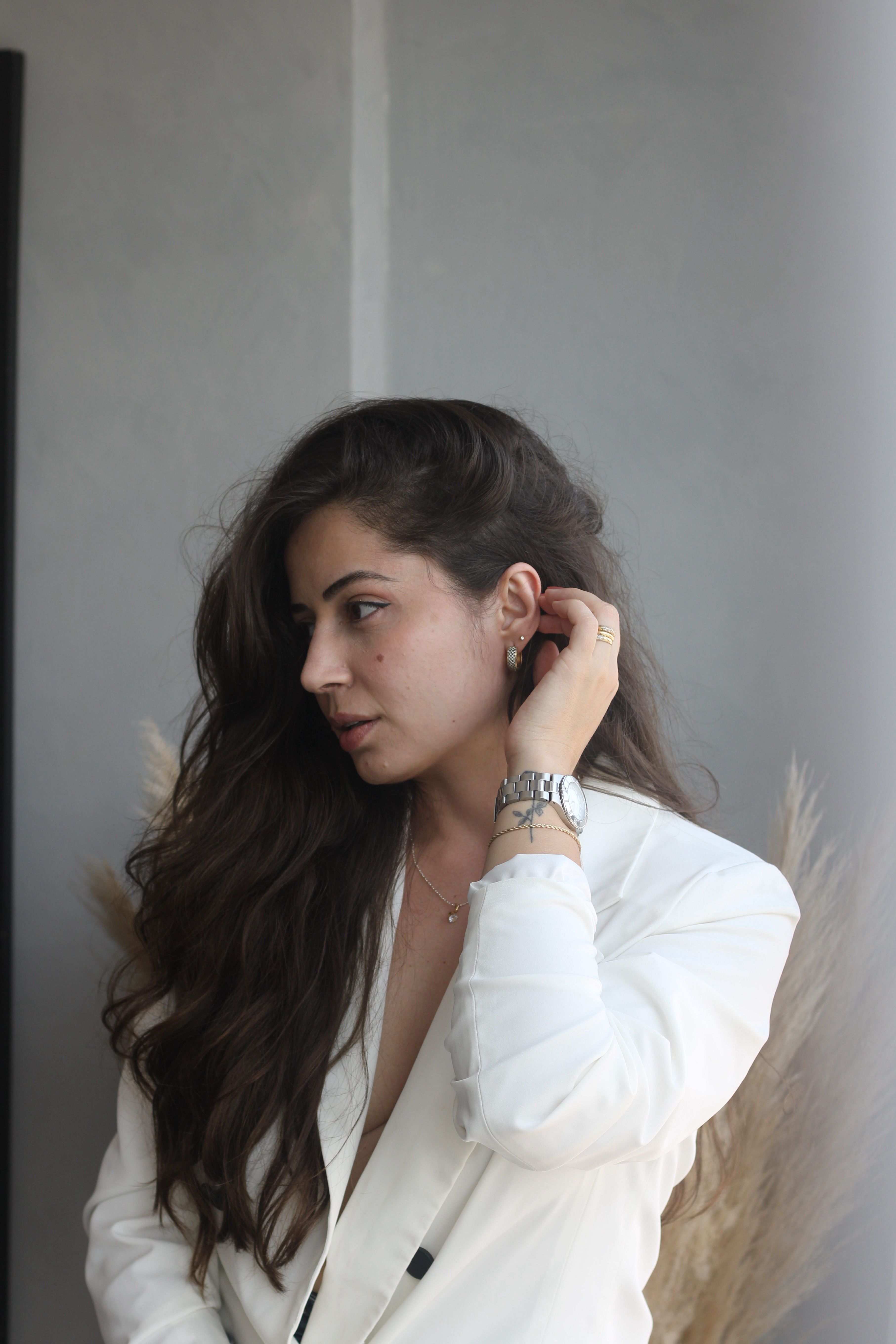 Elegant Woman in White Blazer Indoors · Free Stock Photo