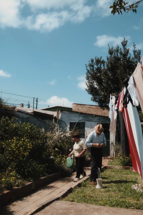 Free Two people tending to a garden in Melo, Uruguay on a sunny day. Stock Photo