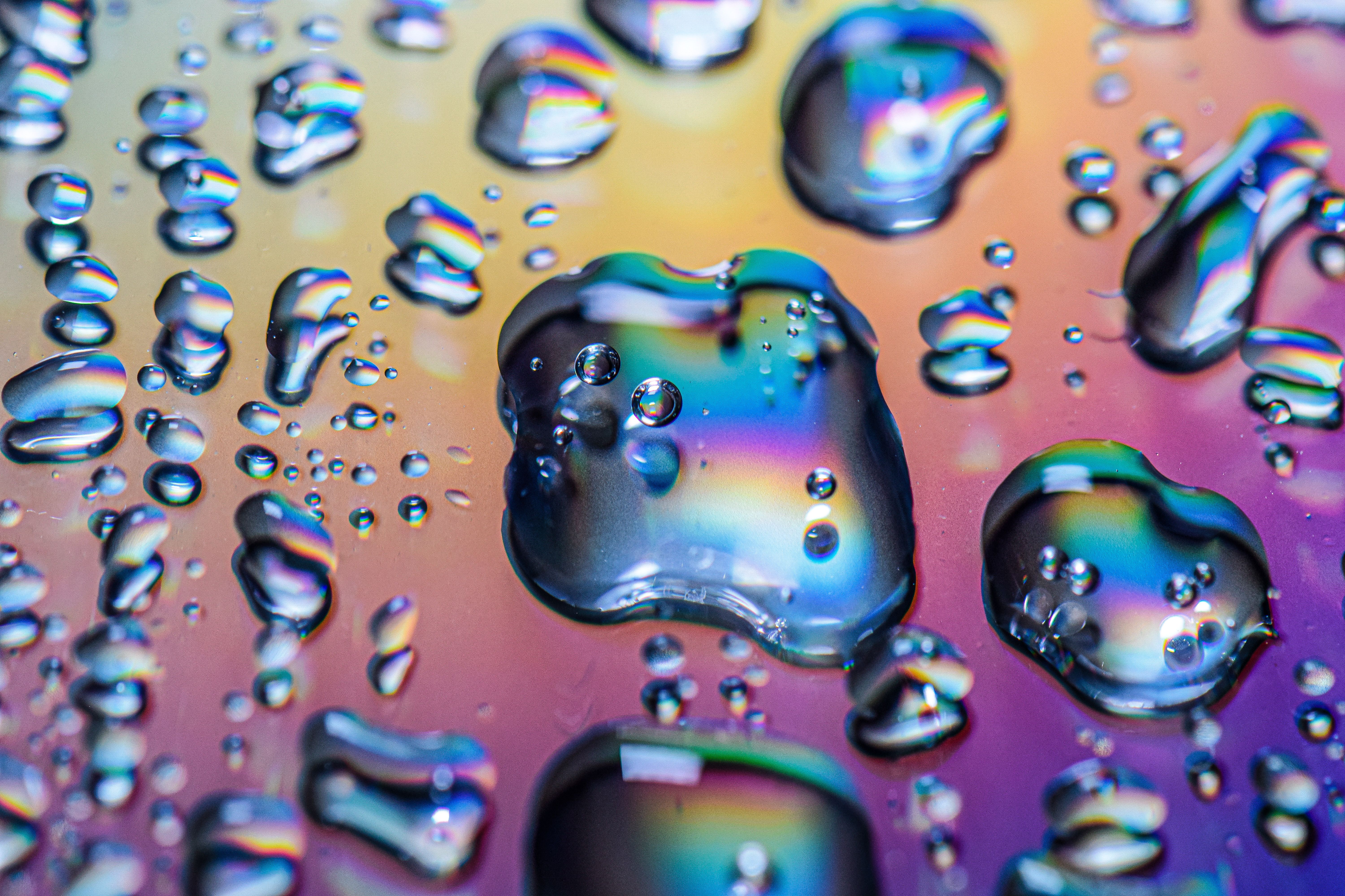 Colorful Water Droplets on Rainbow Surface · Free Stock Photo