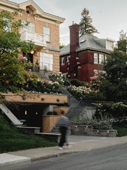 Elegant historic homes in Montreal's lush residential district, blending brick and greenery.
