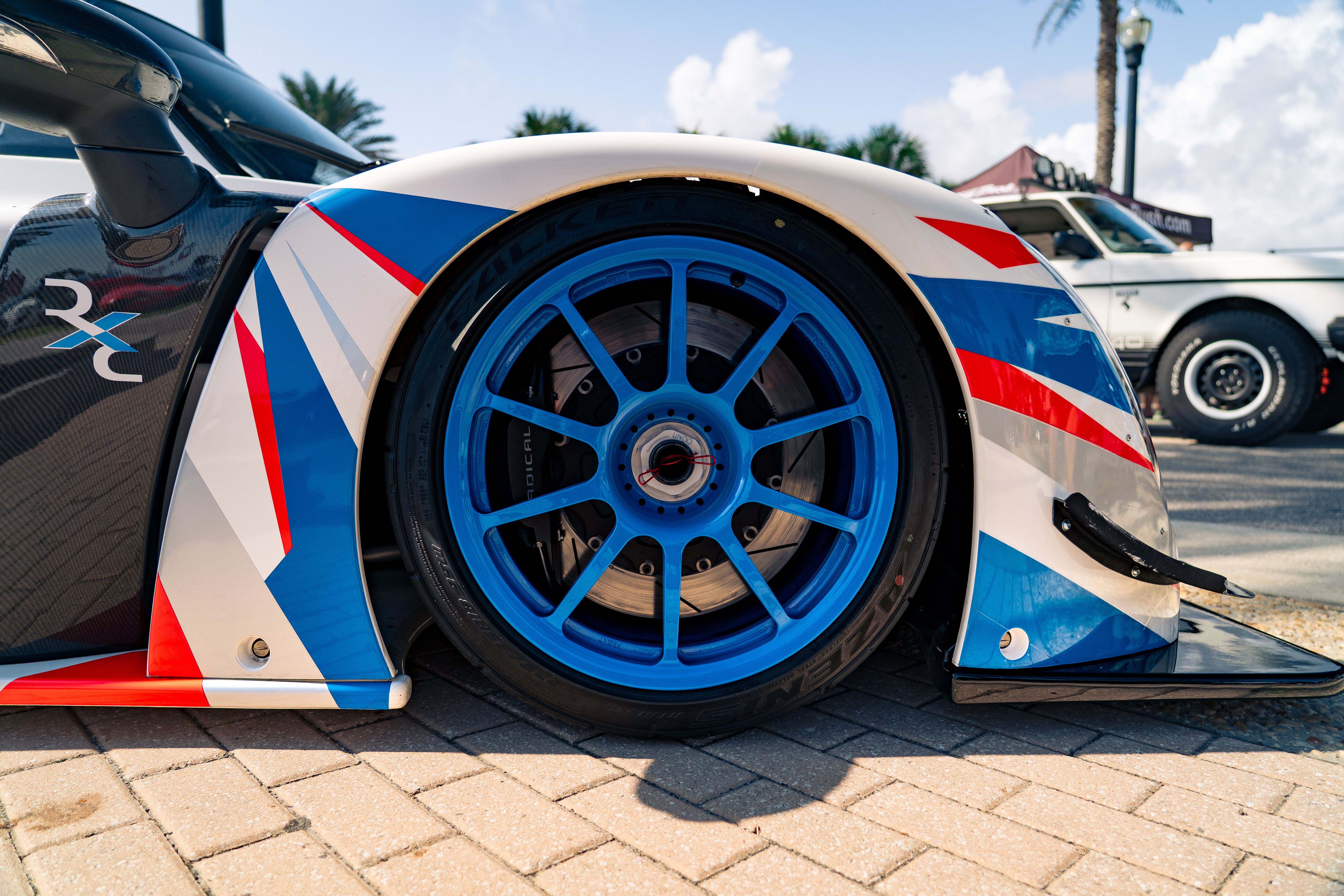 Close-Up of Sportscar Wheel with Vibrant Colors · Free Stock Photo