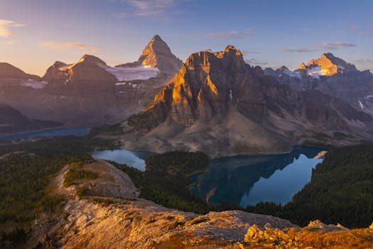 Stunning sunrise view of Mount Assiniboine reflecting in a glacial lake, Canada.
