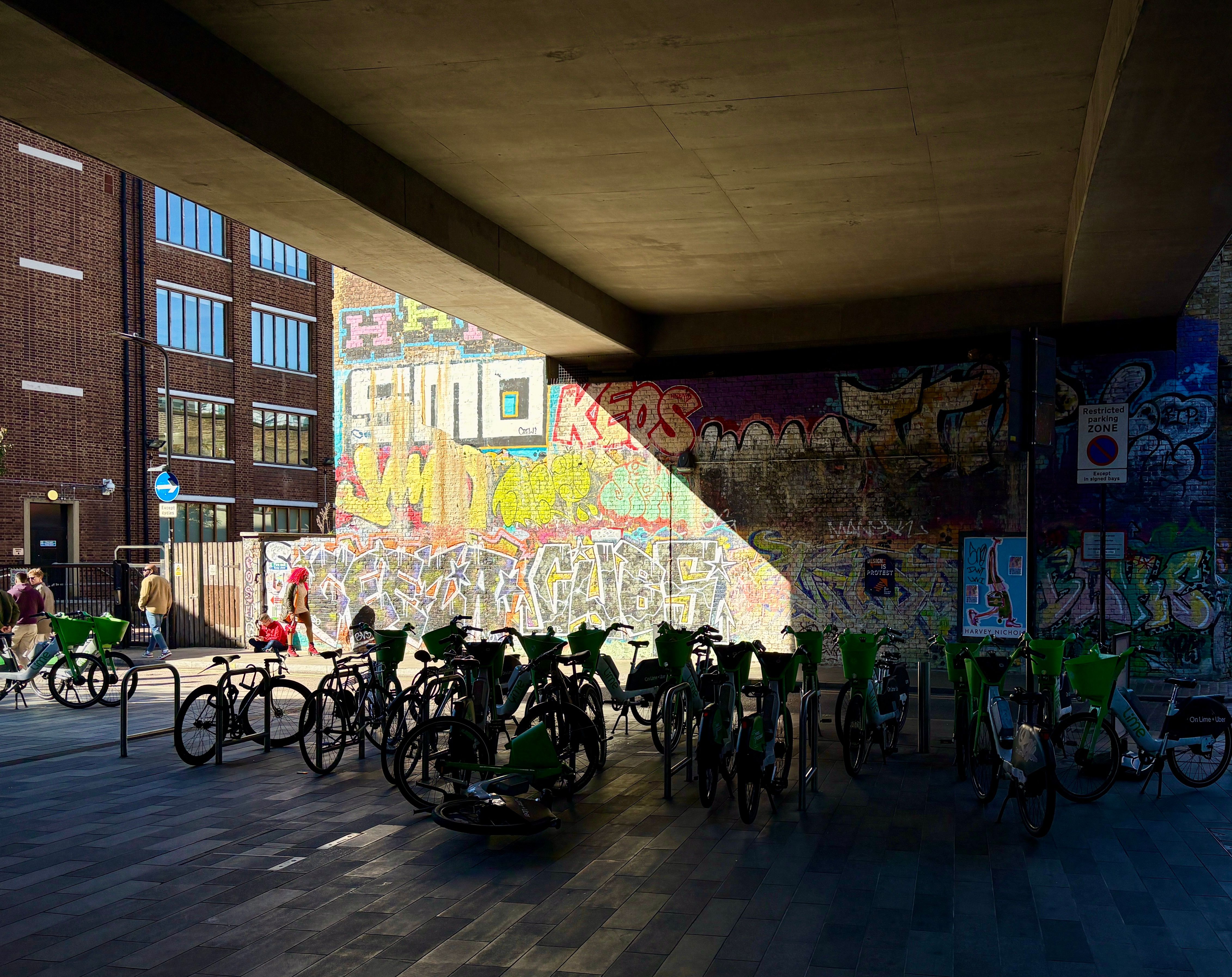 Street View of Urban Graffiti and Bicycle Racks · Free Stock Photo