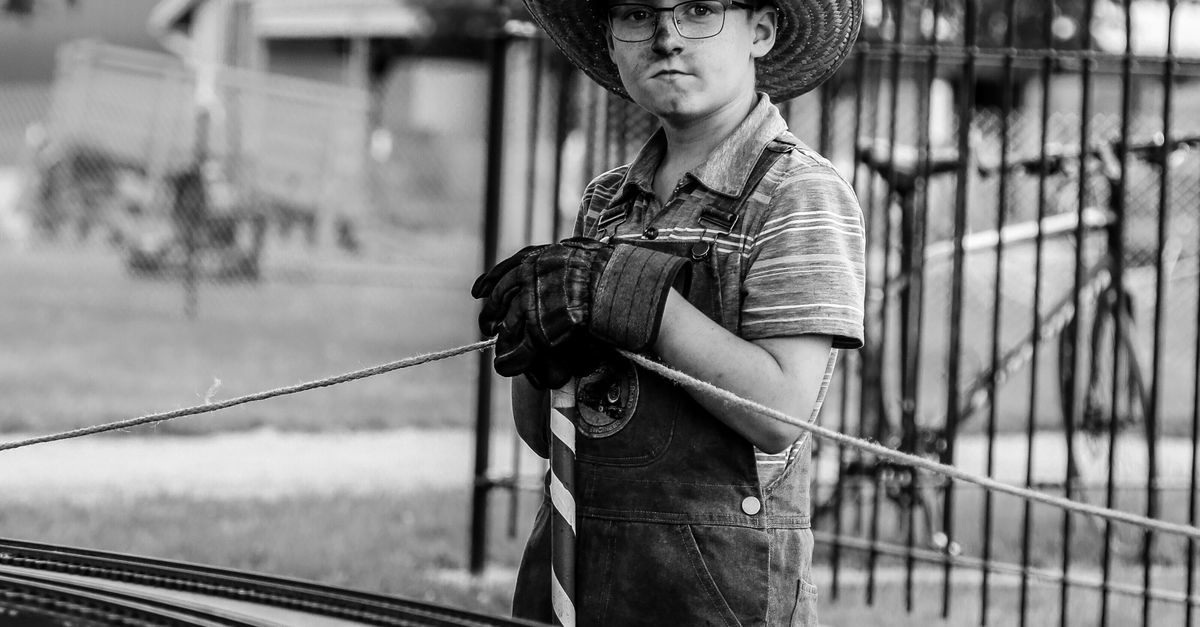 Mini Train Conductor Boy in Train Conductor Outfit at Miniature Railway · Free Stock Photo