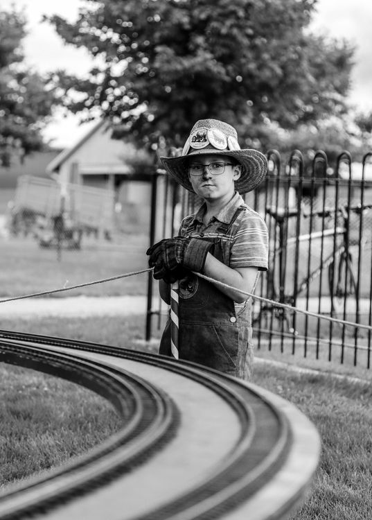 Mini Train Conductor Boy in Train Conductor Outfit at Miniature Railway · Free Stock Photo