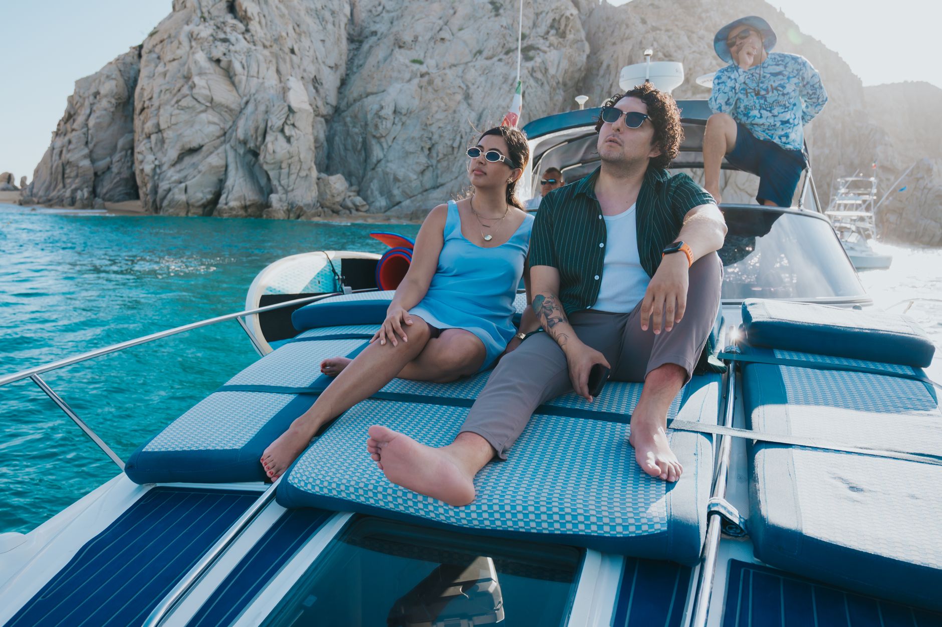 A group of friends enjoying a sunny day on a yacht in Cabo San Lucas, Mexico.