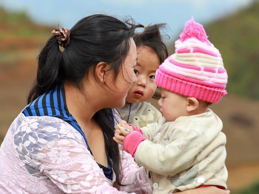Mother and children embrace cultural traditions in Lào Cai, Vietnam.