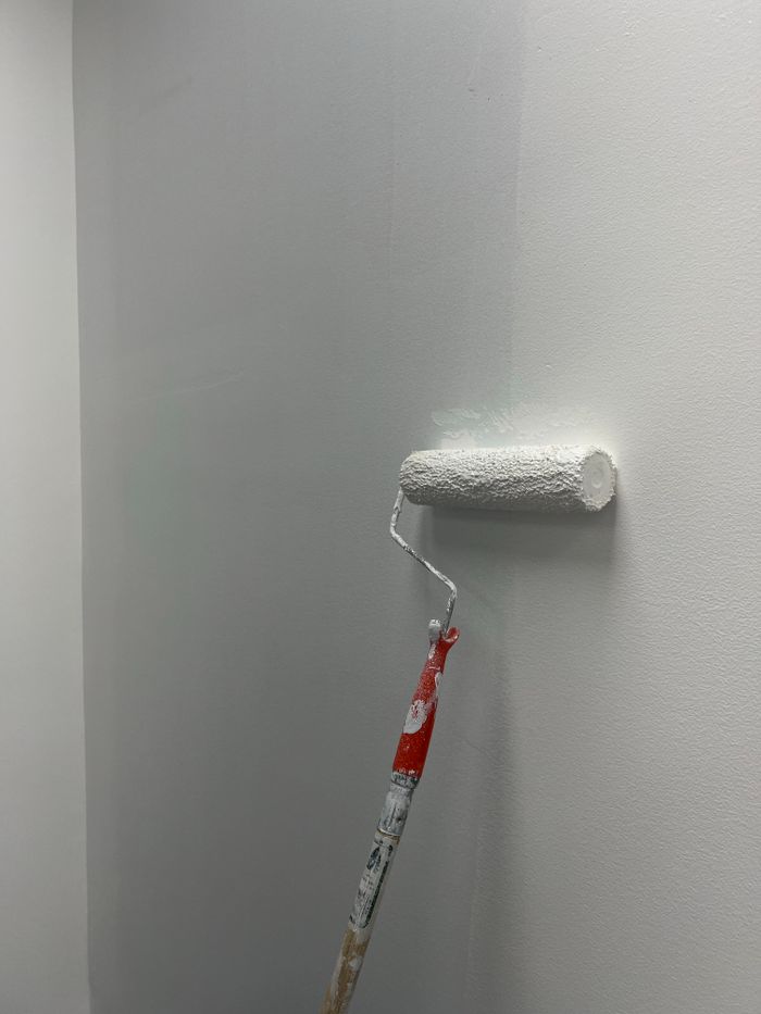 Wall after repainting, smooth fresh white paint