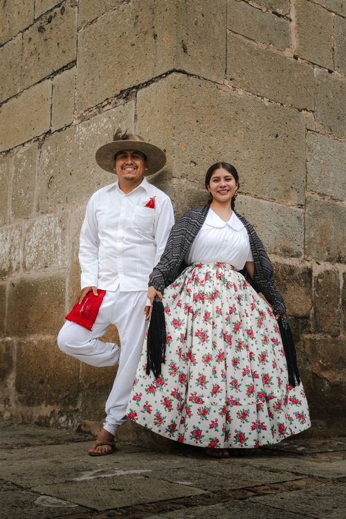 Free A couple in traditional Mexican costumes posing outdoors in Oaxaca City. Stock Photo