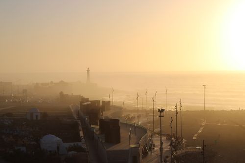 Free Beautiful sunset over the Atlantic Ocean with a lighthouse in Rabat, Morocco. Stock Photo