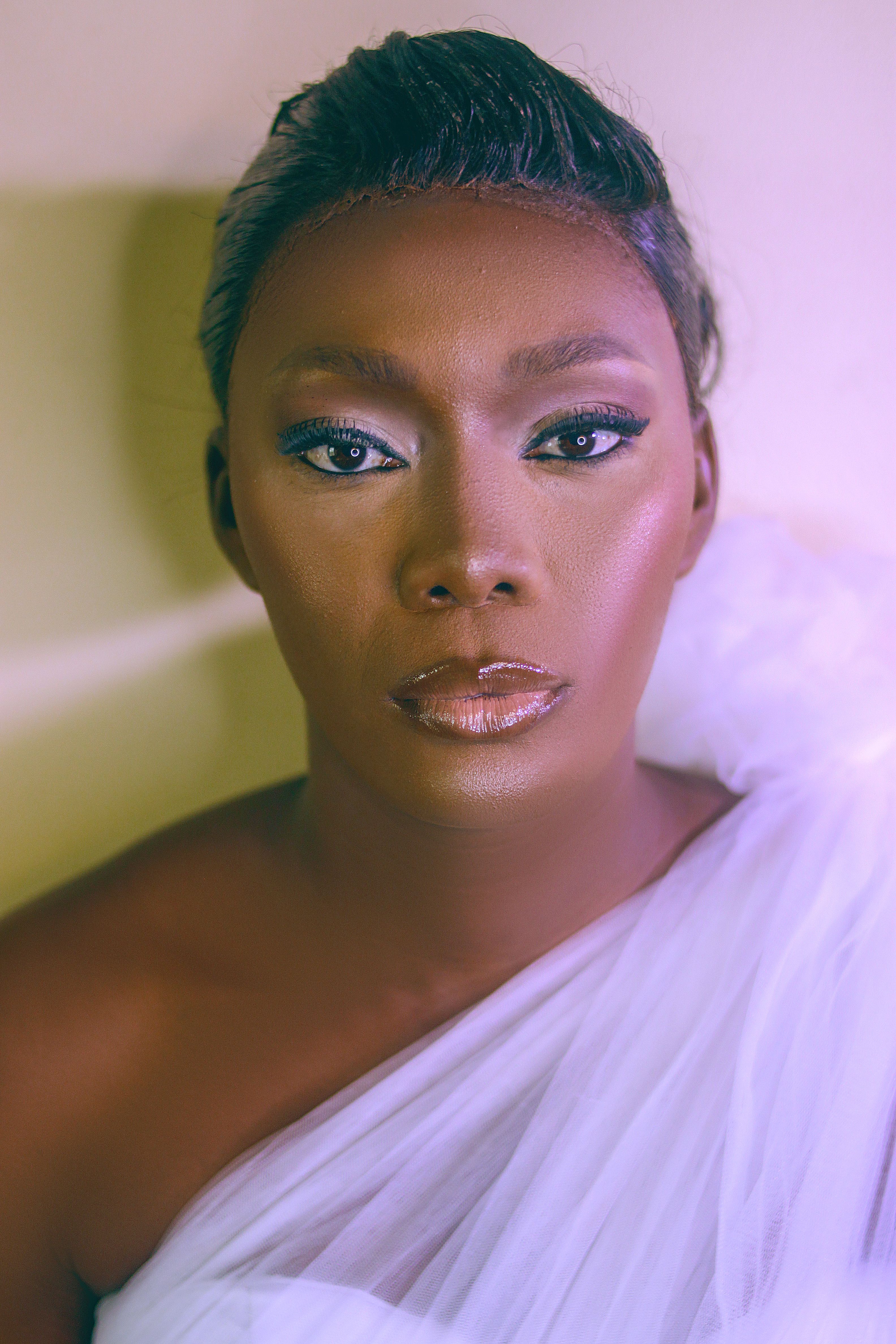 Stunning Portrait of Woman in Elegant Attire · Free Stock Photo