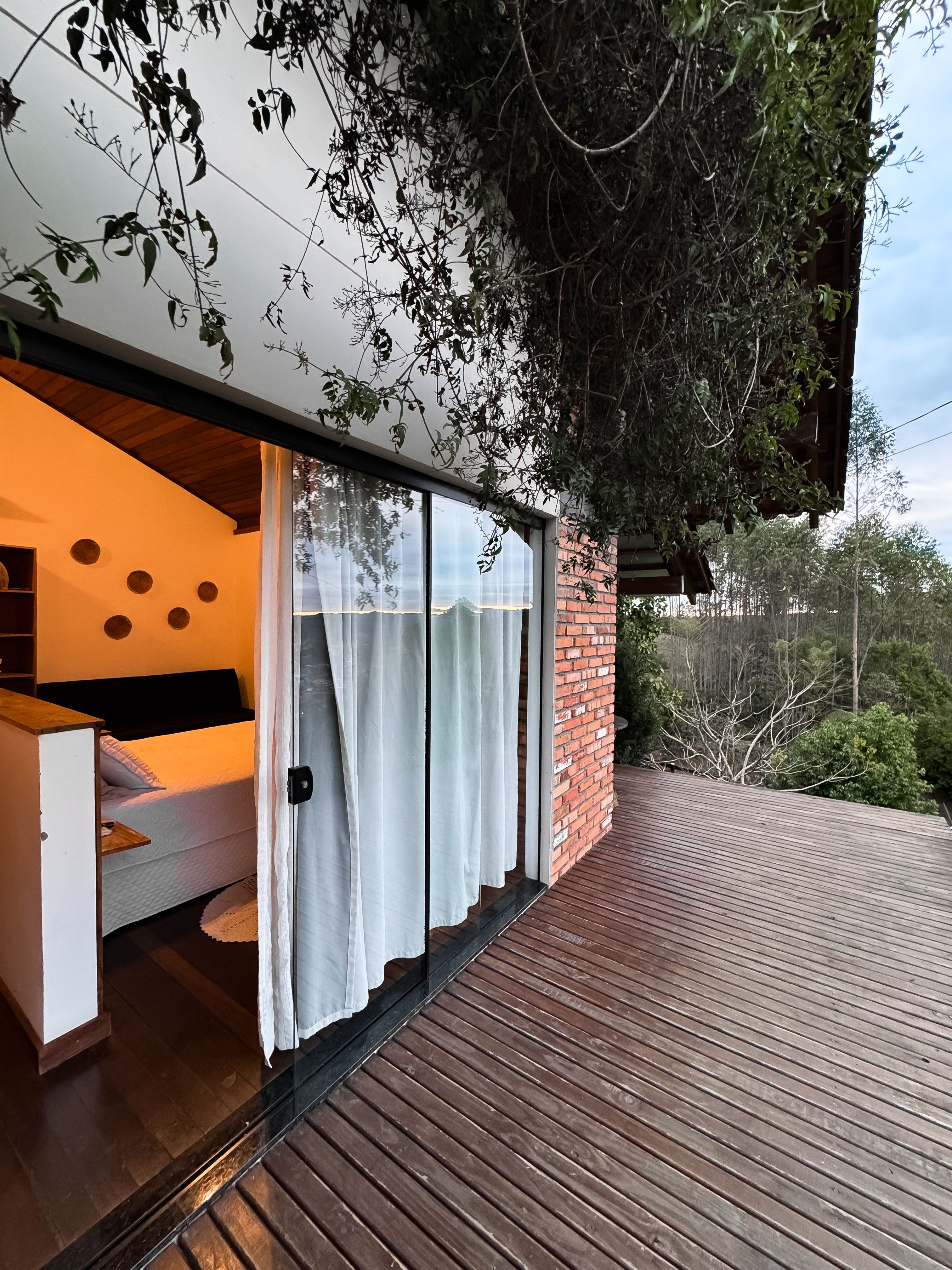 Modern brick house with a wooden deck