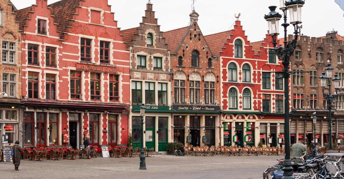 Capture of colorful medieval buildings in Bruges, showcasing rich Flemish architecture.