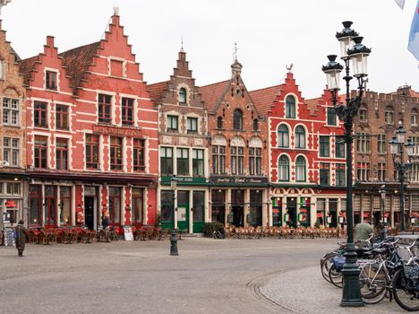 Capture of colorful medieval buildings in Bruges, showcasing rich Flemish architecture.