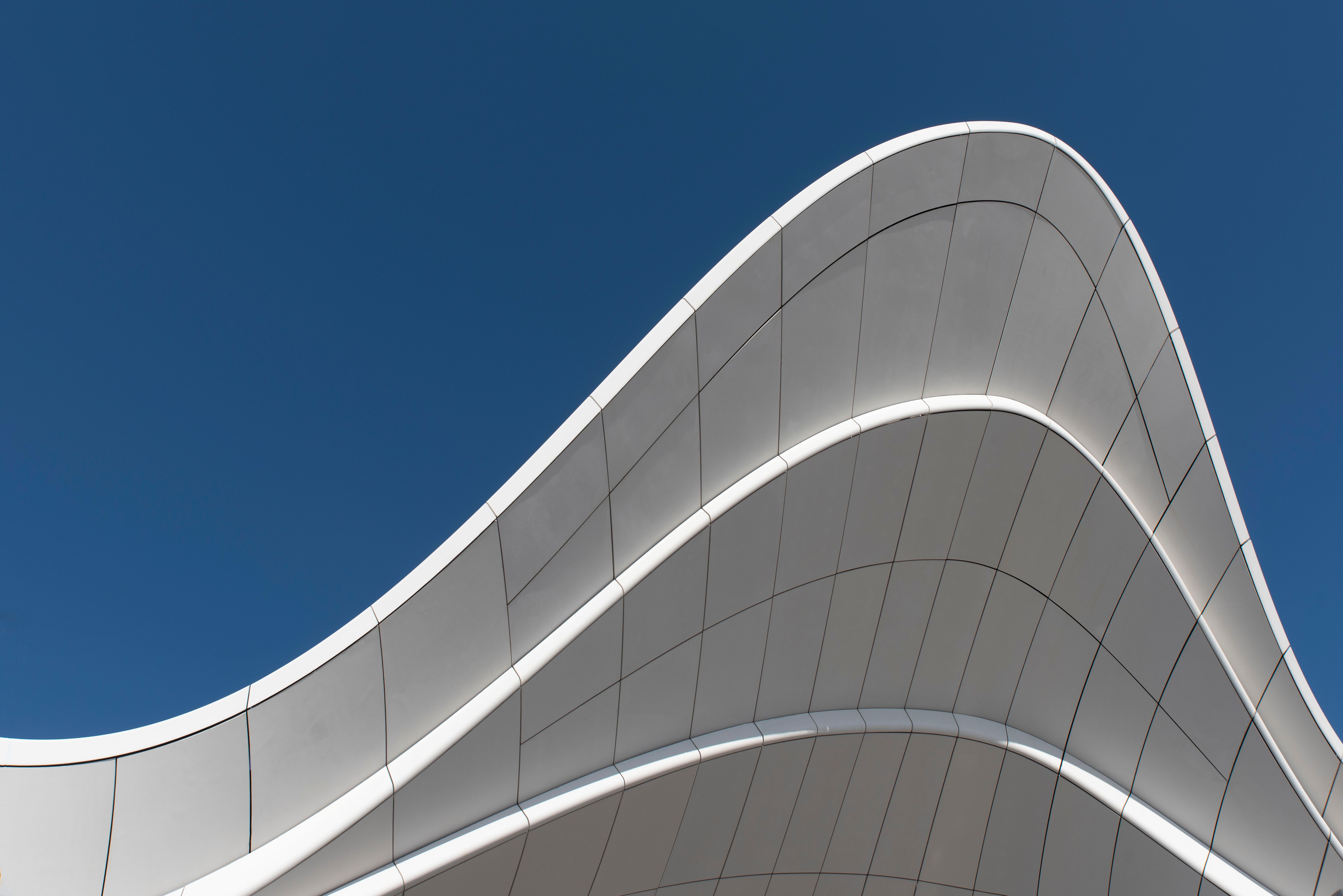 Dynamic Curved Modern Architecture with Blue Sky · Free Stock Photo