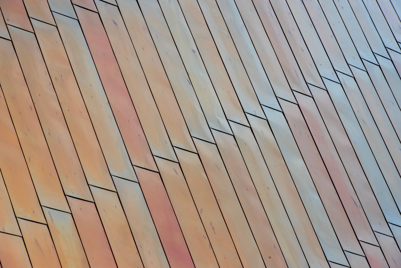 close up abstract view of wooden panels arranged in a zigzag pattern w
