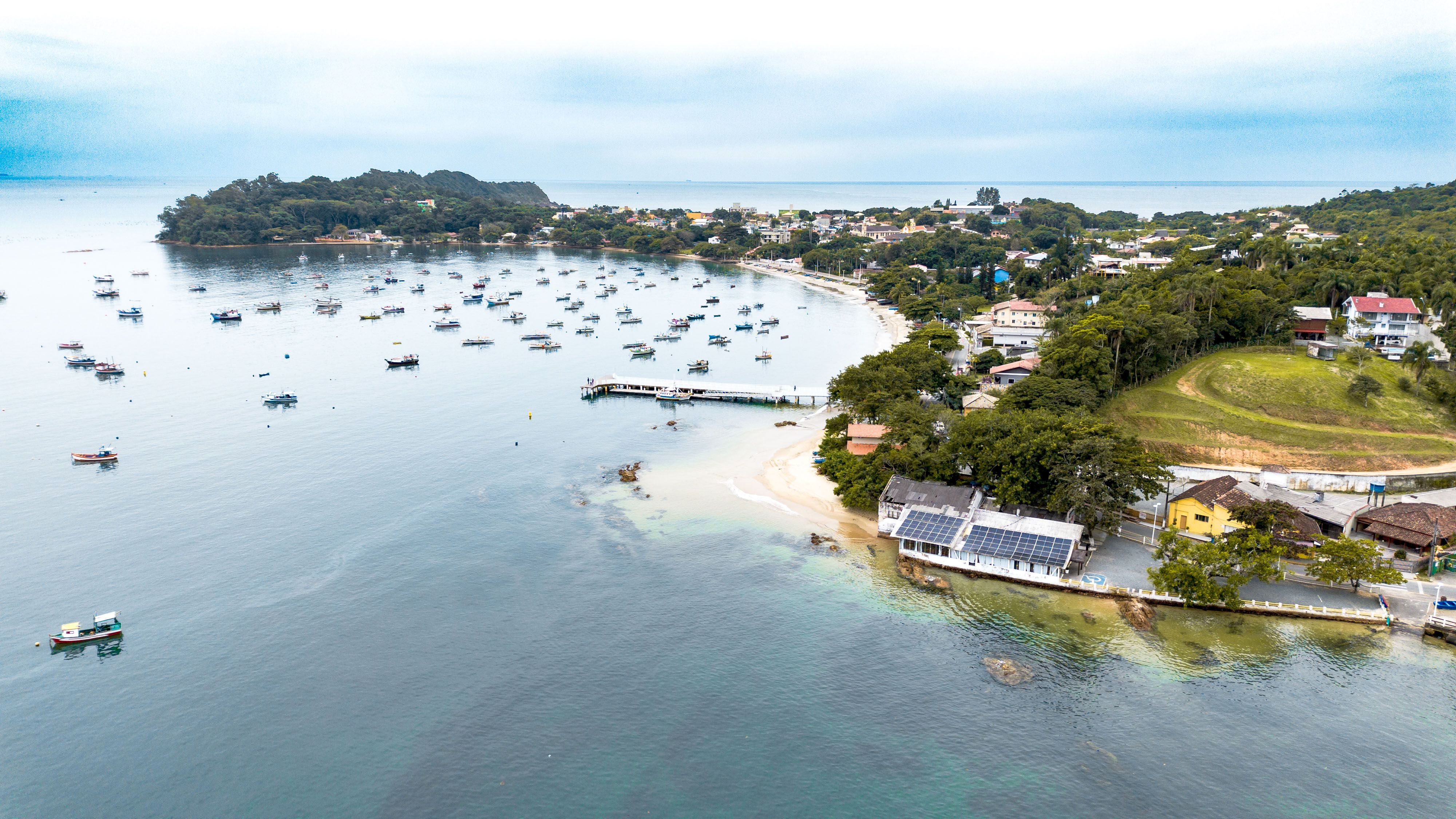 Scenic Aerial View of Coastal Town and Harbor · Free Stock Photo