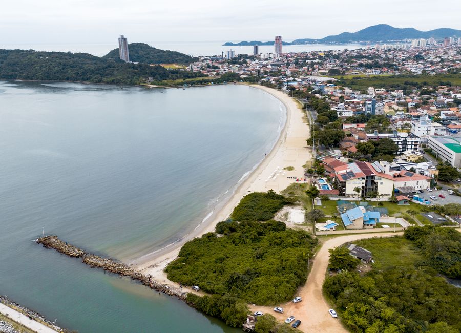 Aerial view of São Francisco do Sul, Brazil, showcasing the coastline and urban landscape.
