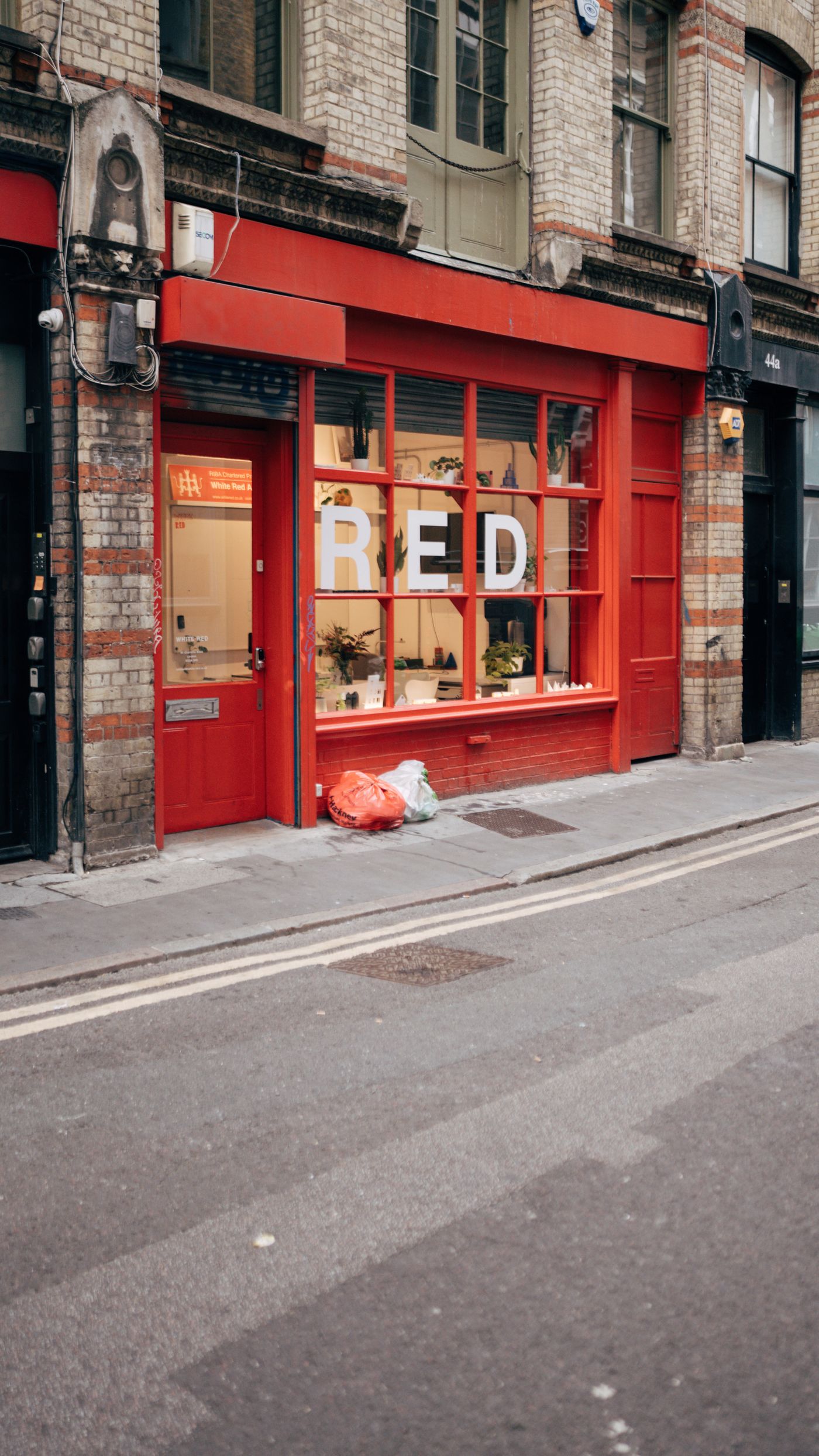 Small shop entrance with new aluminium frame and glass door in London