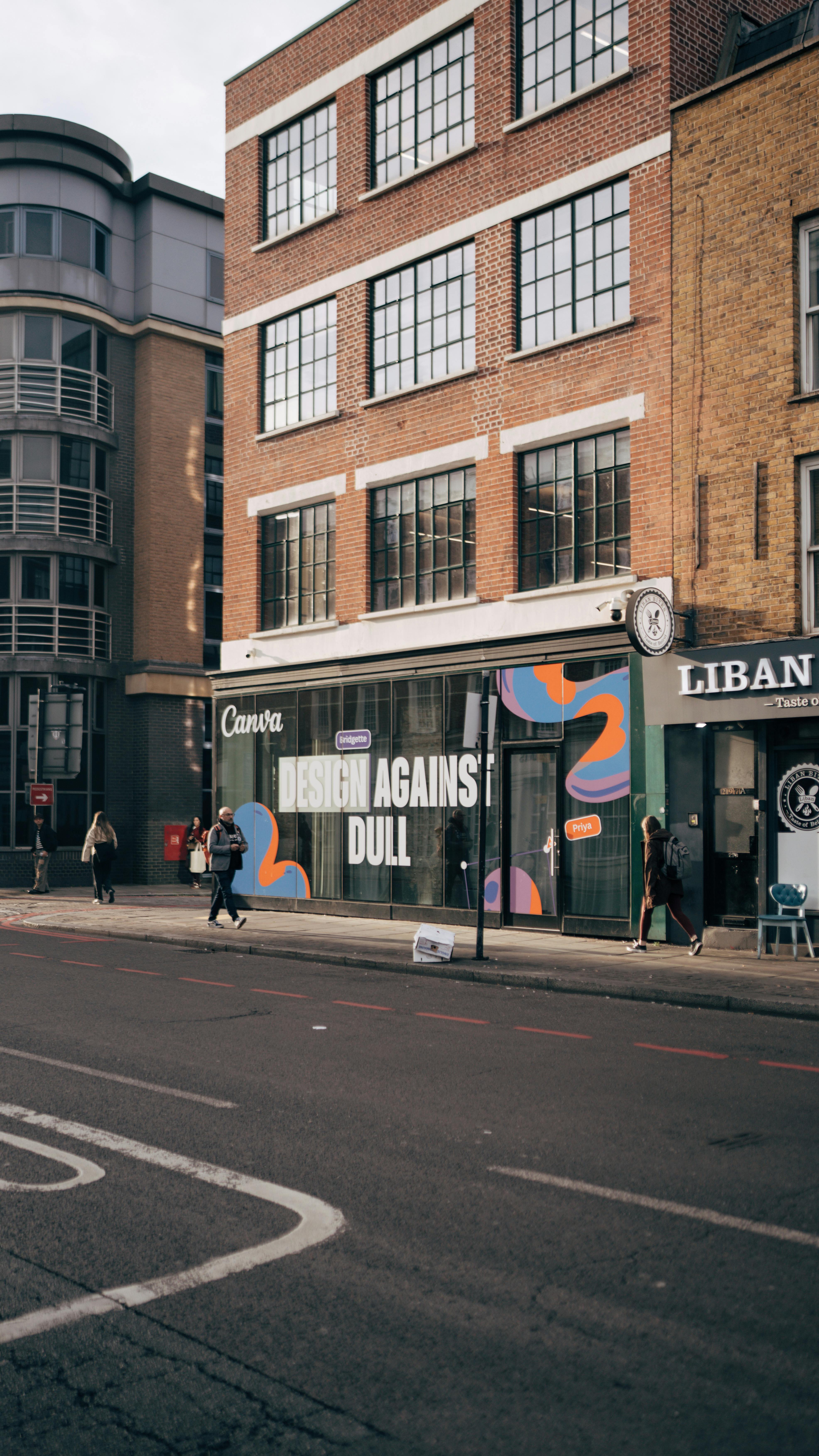 Street view of modern city architecture and pedestrians.
