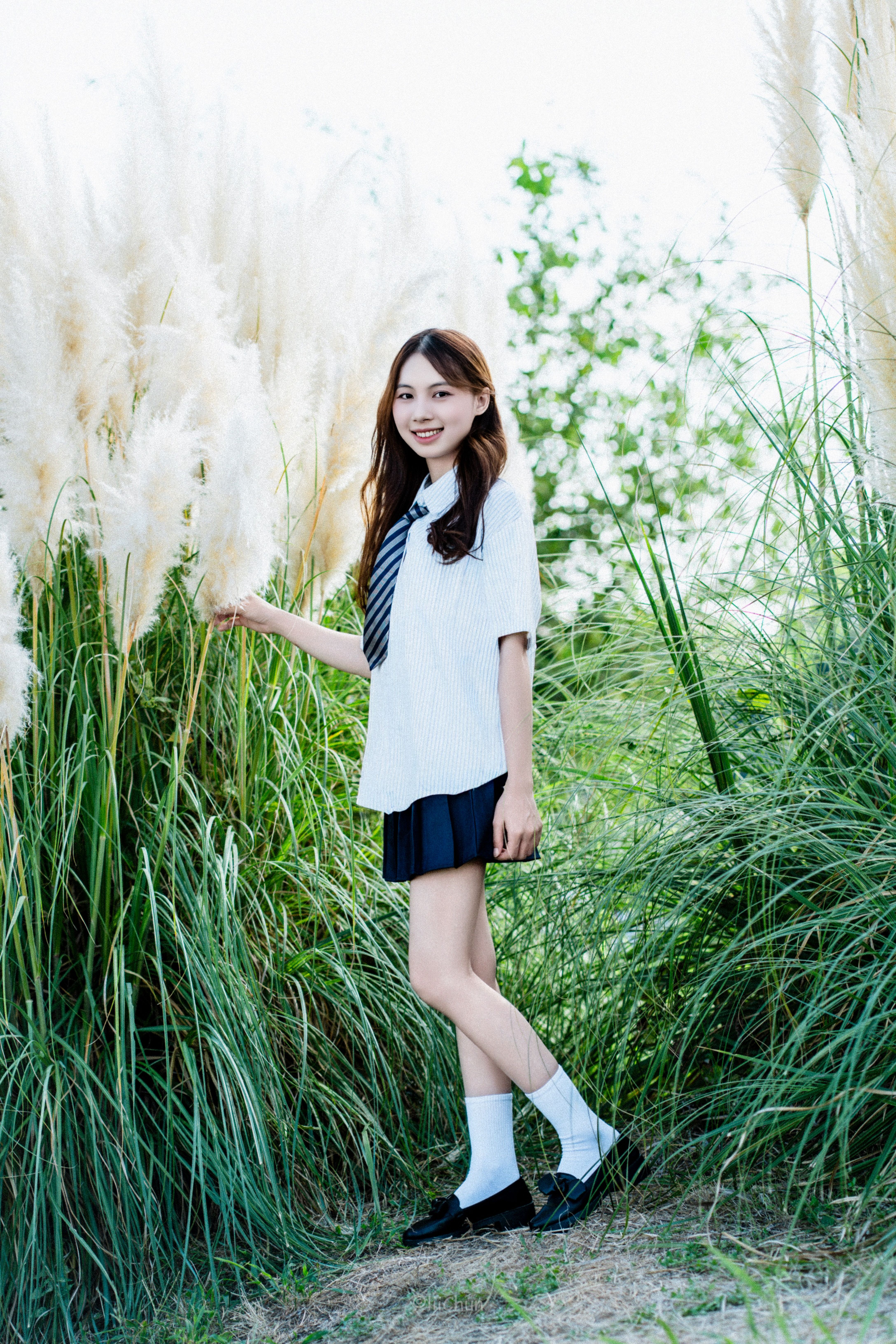 Girl in School Uniform Posing Outdoors · Free Stock Photo