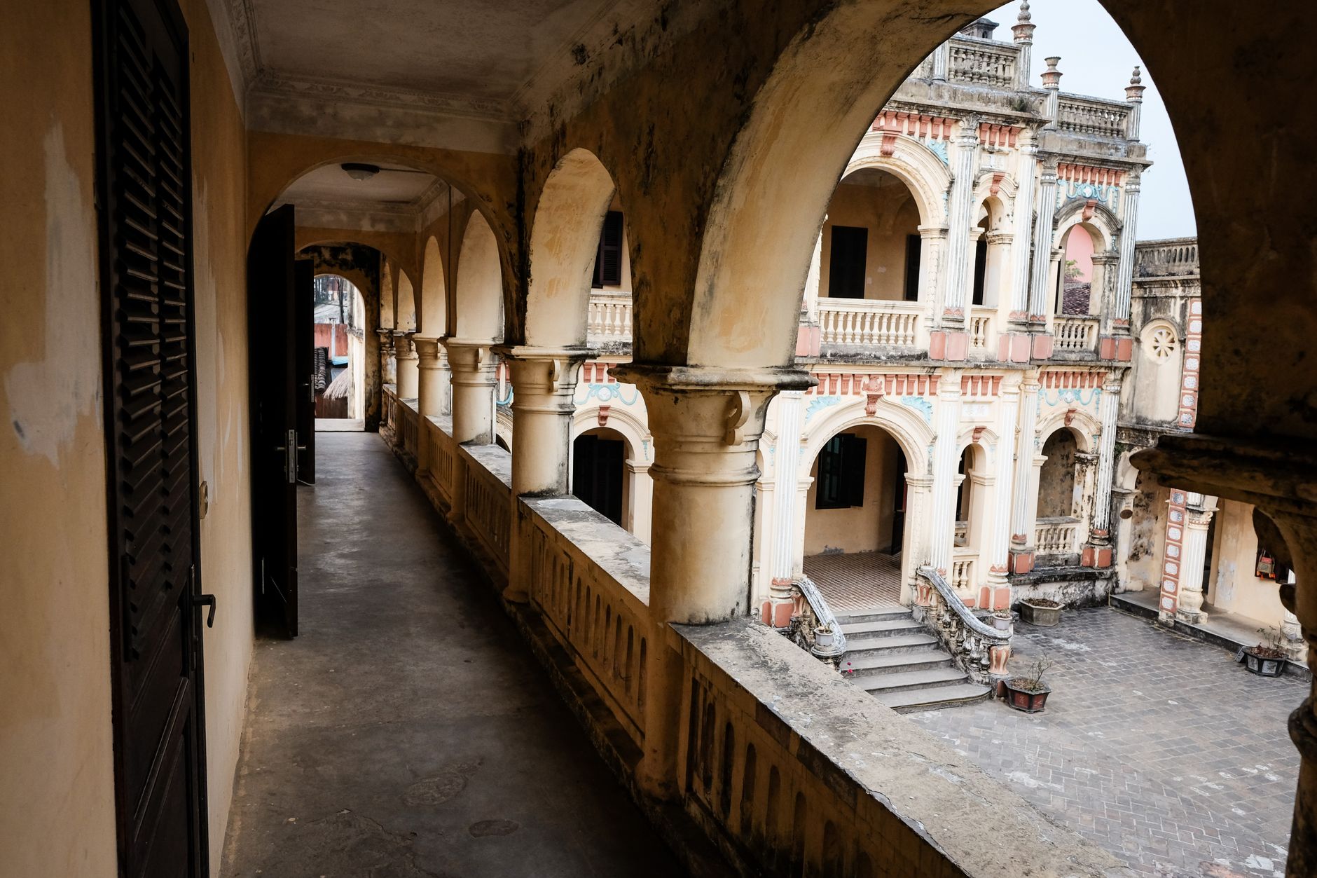 Explore the historic architecture of a beautifully weathered mansion in Lào Cai, Vietnam.