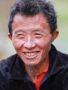Smiling Hmong Man in Traditional Attire
