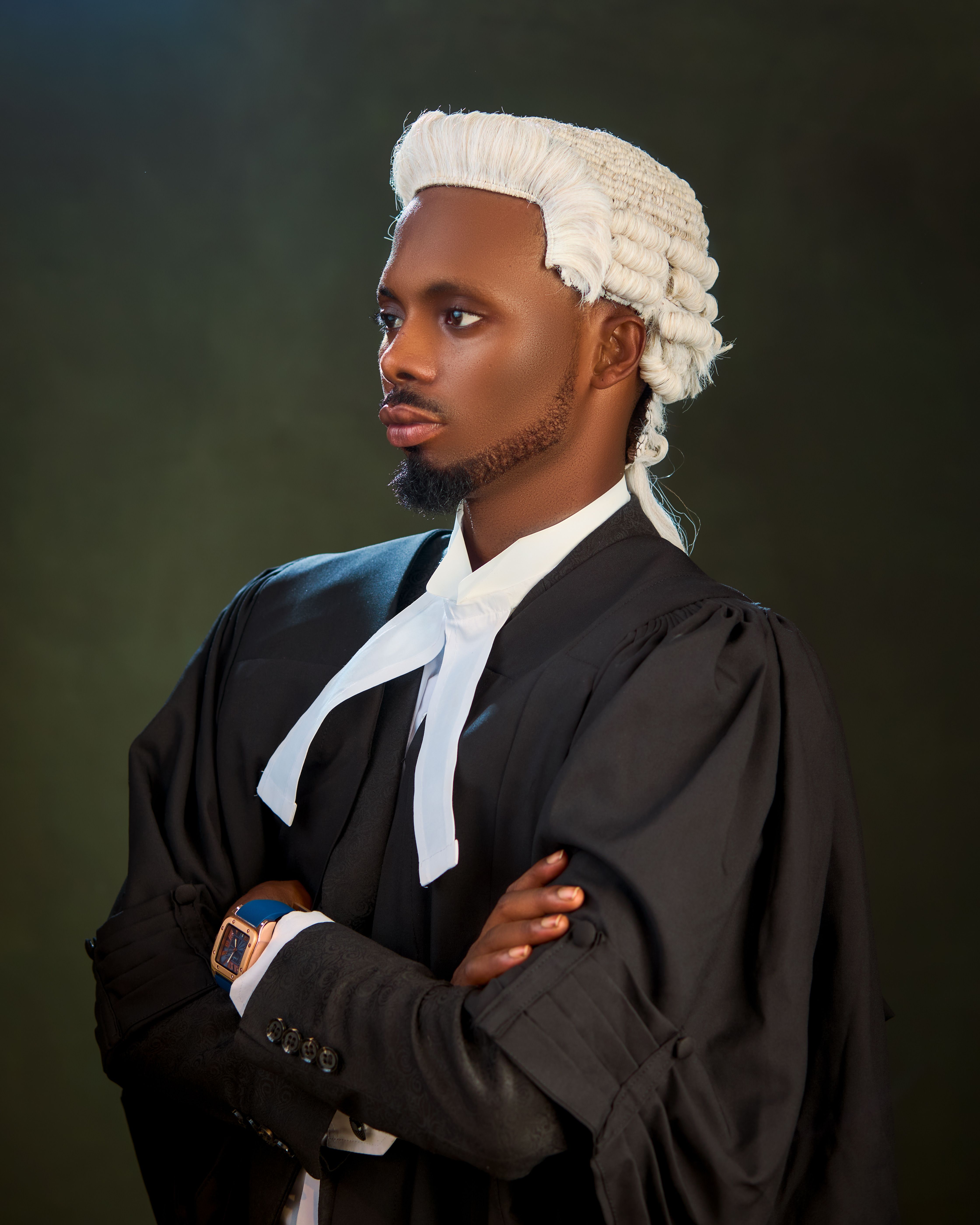 African lawyer in traditional court attire, exuding confidence and professionalism.