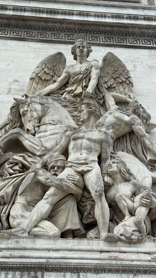 Free Intricate stone sculpture on the historic Arc de Triomphe in Paris, France. Stock Photo