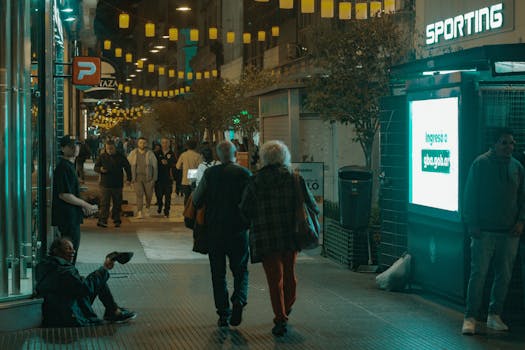 Vibrant nighttime scene of a bustling street in Buenos Aires, Argentina.