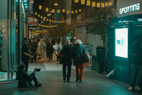 Free A lively nighttime street scene in Buenos Aires with people enjoying the vibrant city atmosphere. Stock Photo