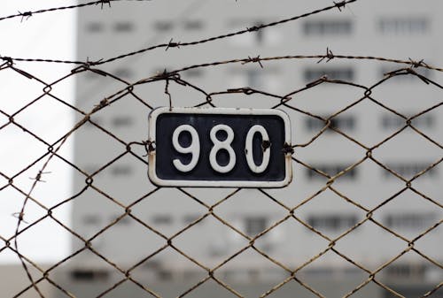 Free 98c Plate on Fence Stock Photo