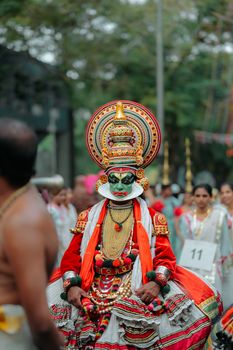 Vibrant Kathakali dancer performing in a cultural festival in Thiruvananthapuram, Kerala, showcasing traditional Indian art.