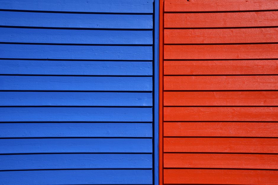 Vibrant blue and red wooden panels form a striking architectural detail.