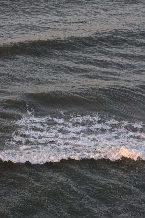 Free Peaceful ocean waves during sunset in Morocco showcasing nature's tranquility. Stock Photo