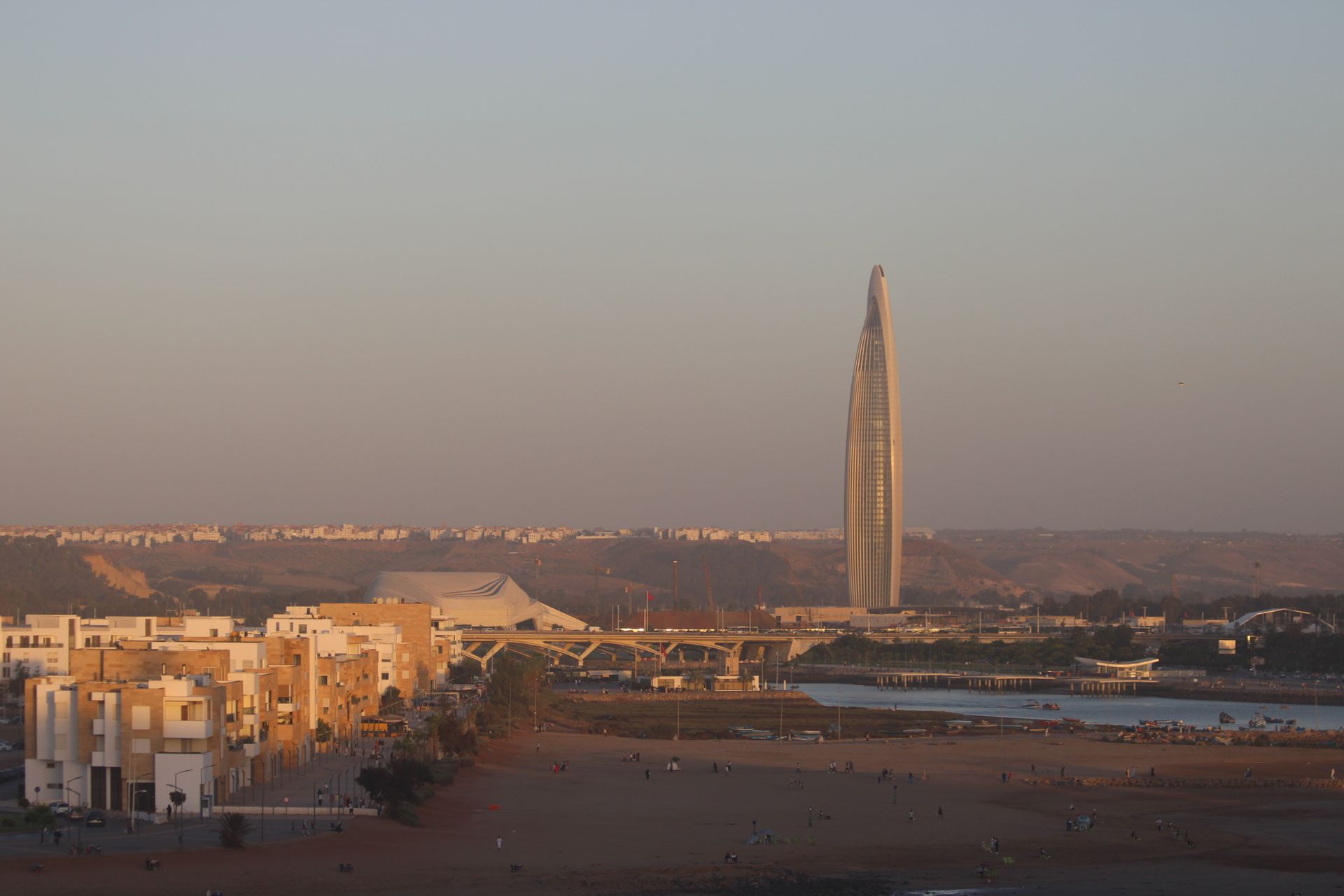 A scenic view of Rabat featuring the tallest skyscraper in Morocco during sunset.