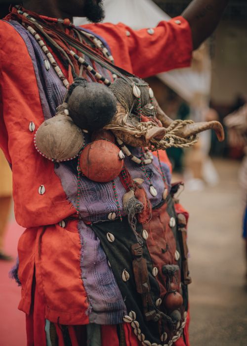 Free Close-up of colorful African traditional clothing adorned with beads and decorative items. Stock Photo