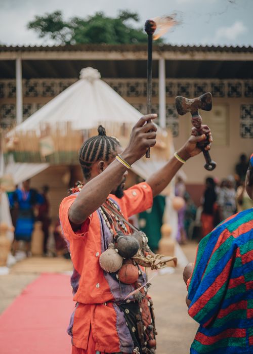 Free Colorful traditional African ceremony scene with participants in vibrant attire and cultural symbols. Stock Photo