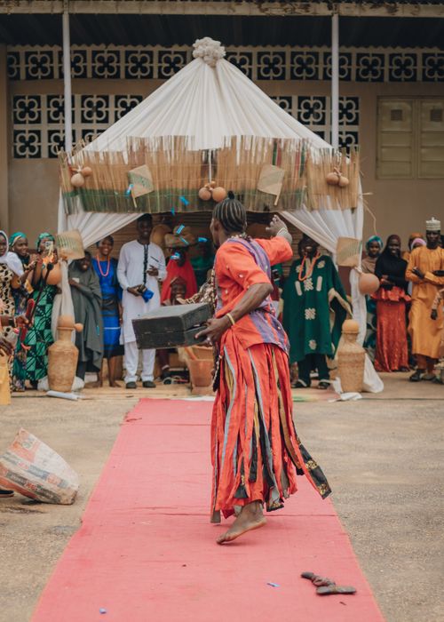 Free A vibrant traditional dance performance at an African cultural ceremony with people in traditional attire. Stock Photo