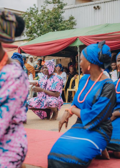 Free Vibrant traditional African ceremony featuring people in colorful attire and cultural expressions. Stock Photo