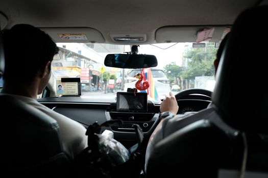 Experience a typical taxi ride through the streets of Bangkok, Thailand.