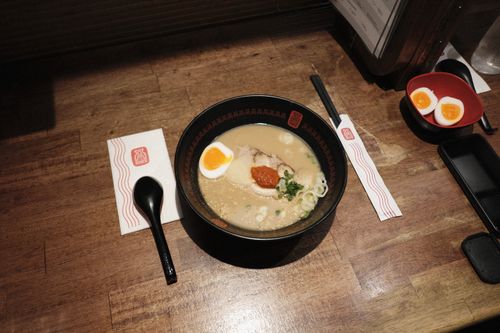 Free Delicious ramen served with eggs and sliced pork, captured in a Bangkok restaurant. Stock Photo