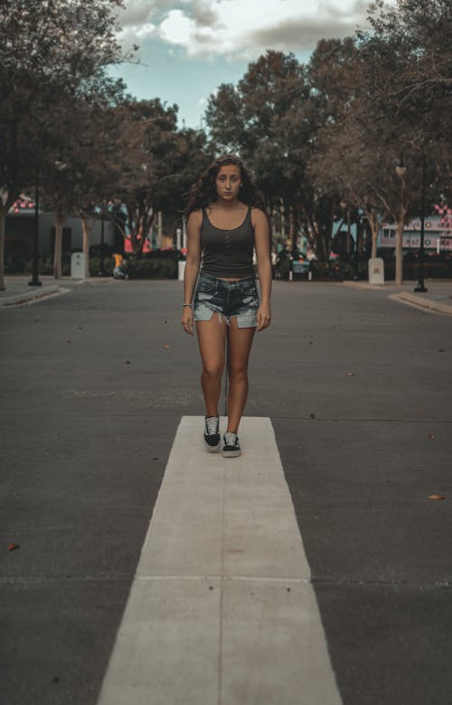 Woman Standing on Road