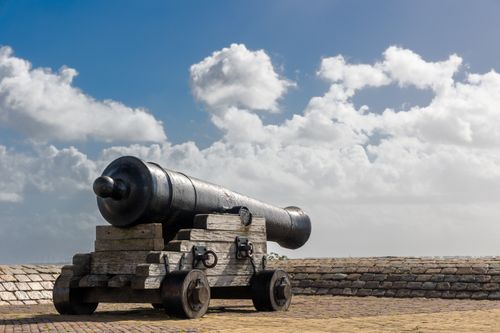 Free A historic cannon on display at the Hellevoetsluis Fort in South Holland, under a clear blue sky. Stock Photo