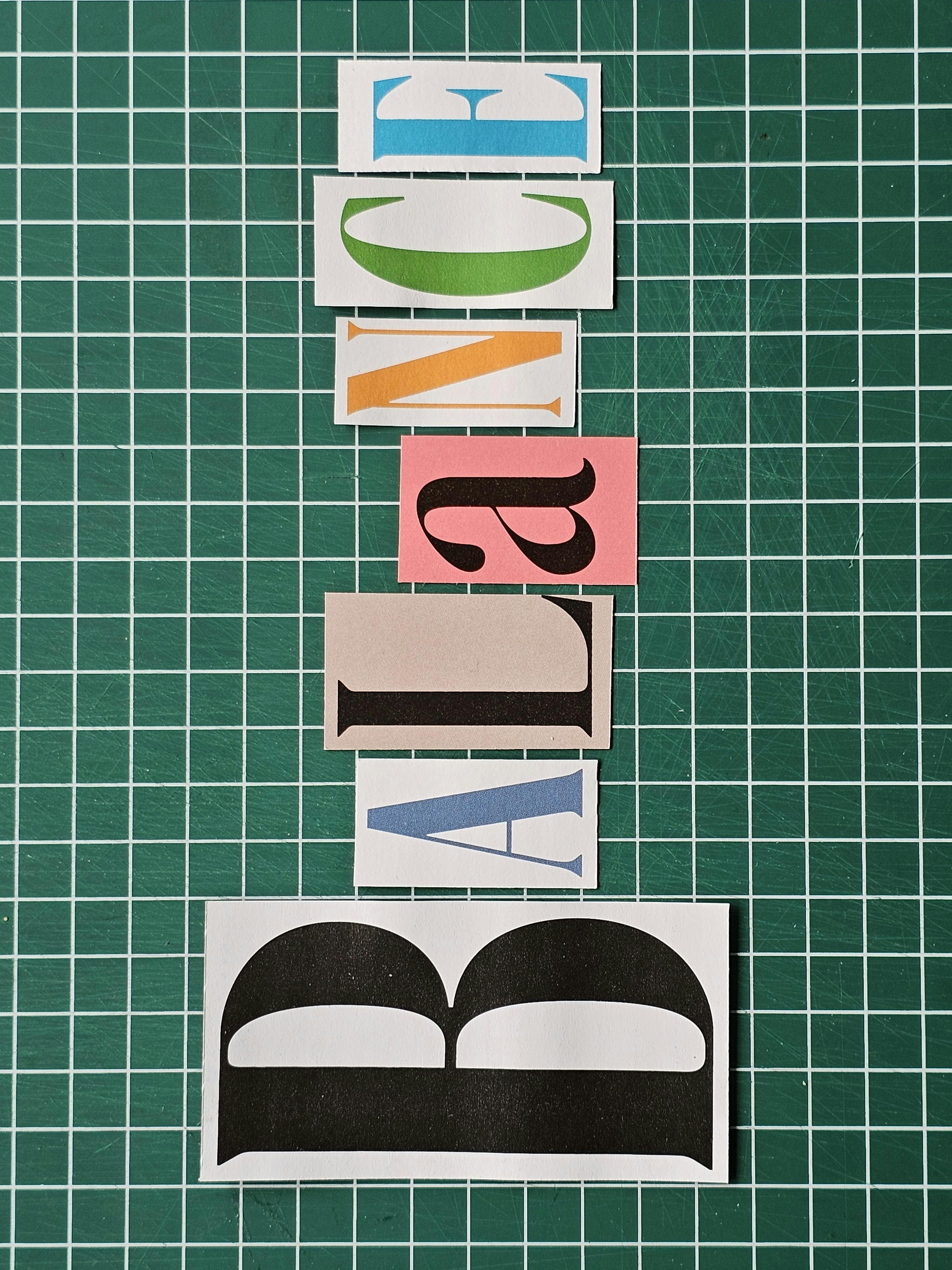 Colorful letters spelling 'BALANCE' on a green grid background, artistic design.