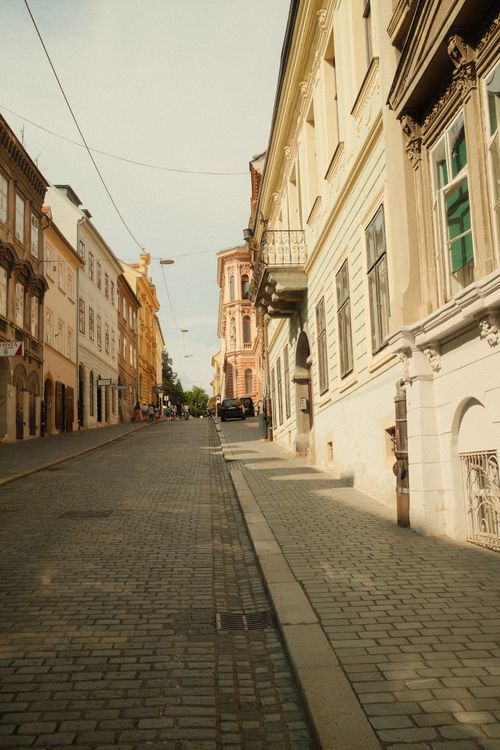 Free Explore a picturesque street in Zagreb, showcasing vibrant architecture under a warm summer day. Stock Photo