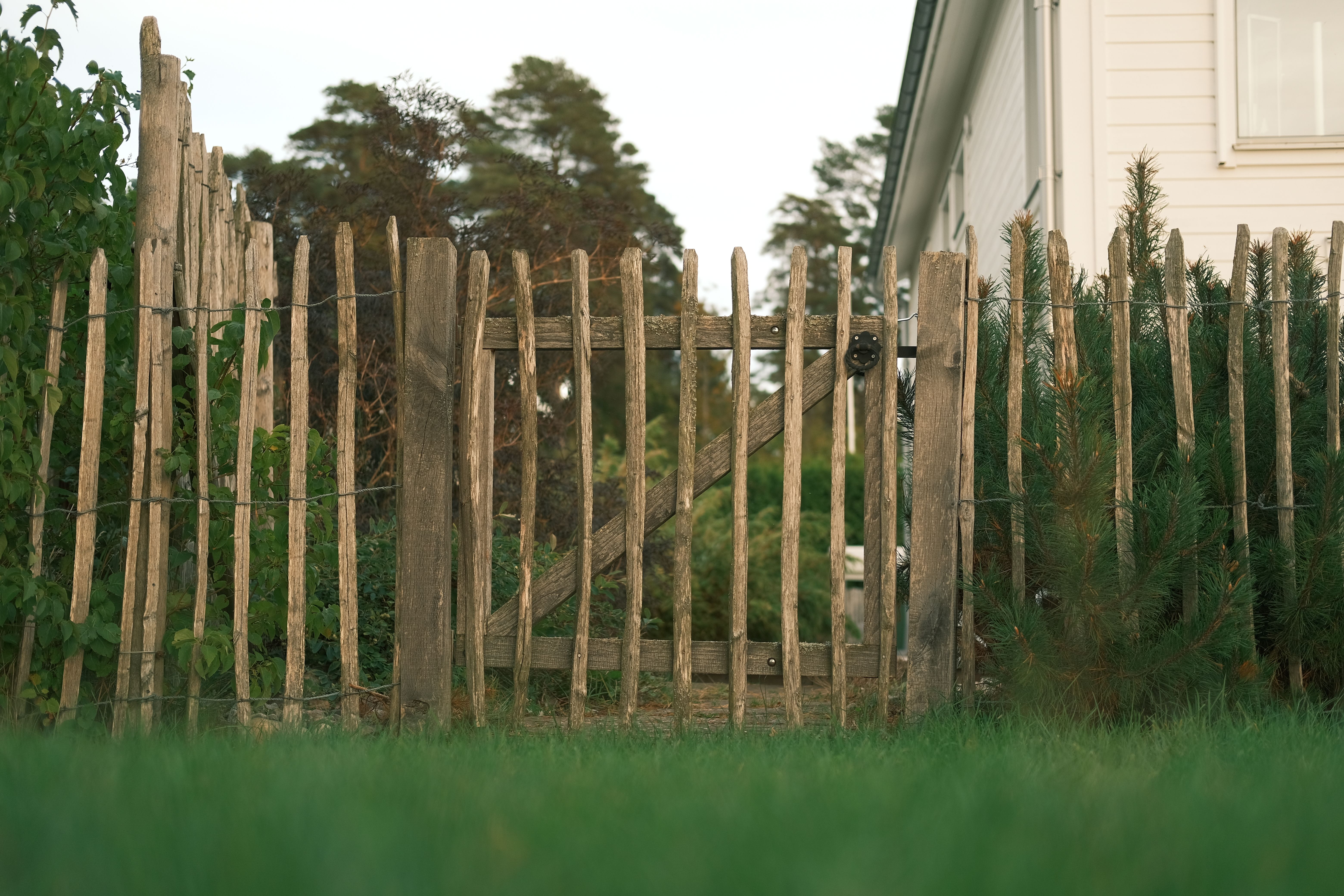 Rustic Wooden Fence in a Countryside Yard · Free Stock Photo