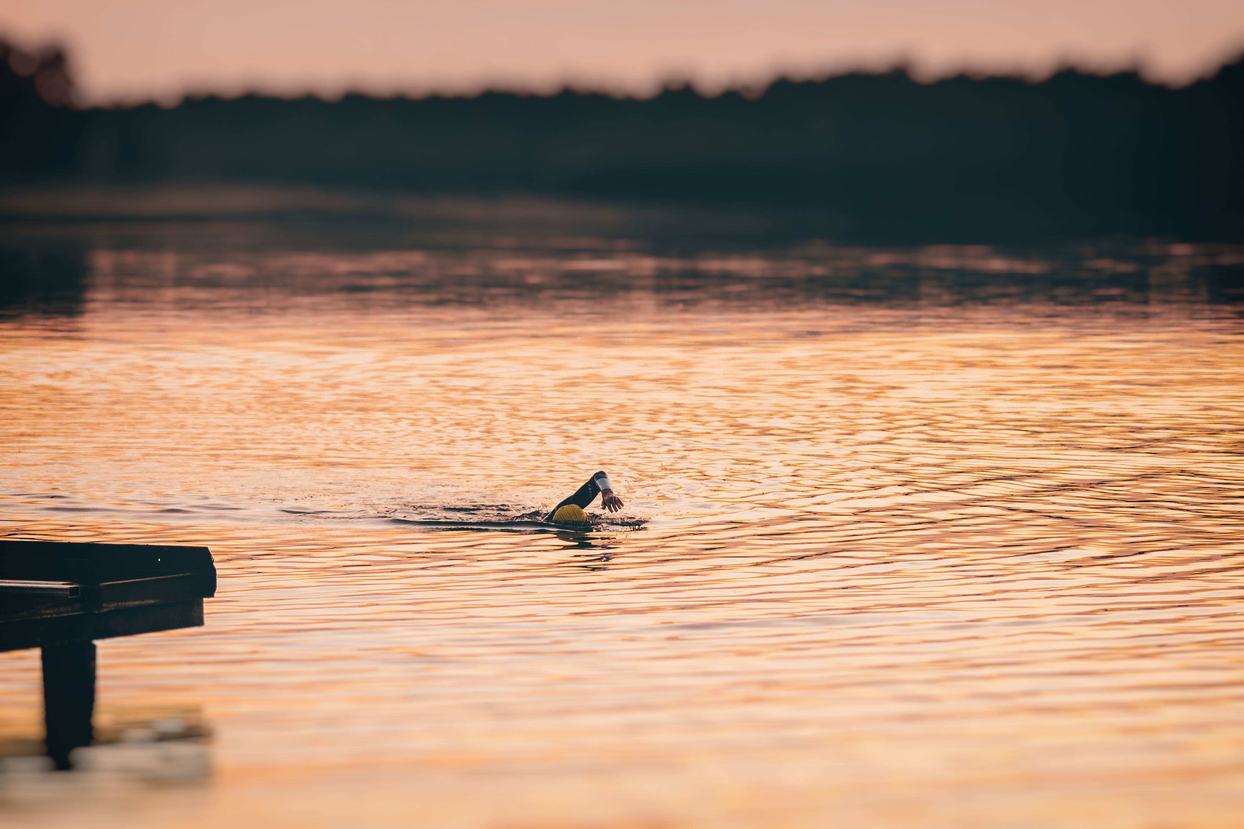 athlete swimming outdoor lake