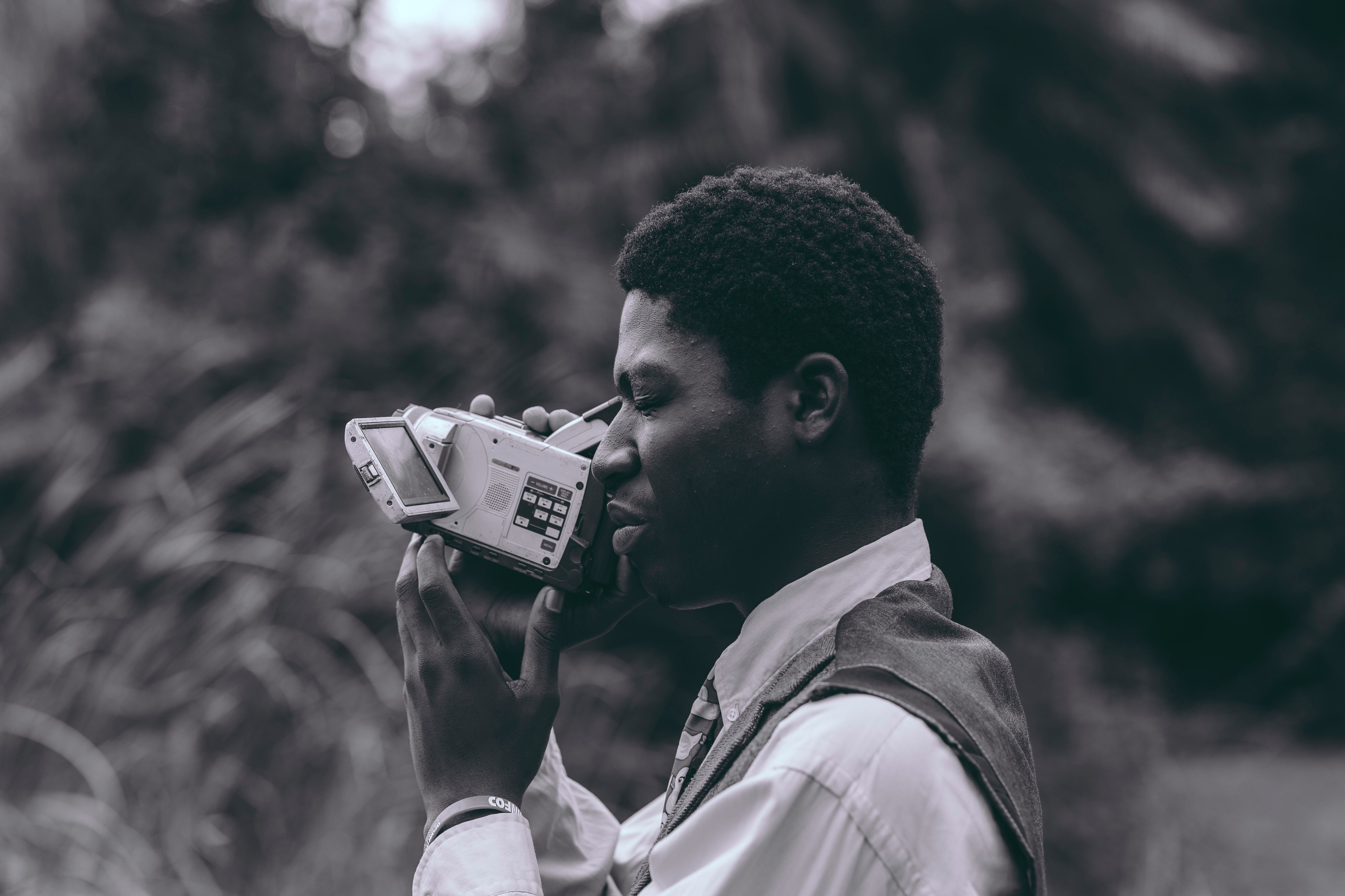 Vintage-Inspired Portrait with Video Camera in Nature · Free Stock Photo