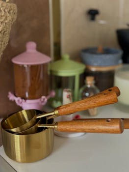 Warm and cozy kitchen scene with measuring cups and colorful jars.